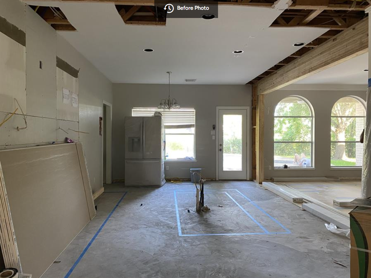 before photo of kitchen during demolition showing wall removal and structural beam