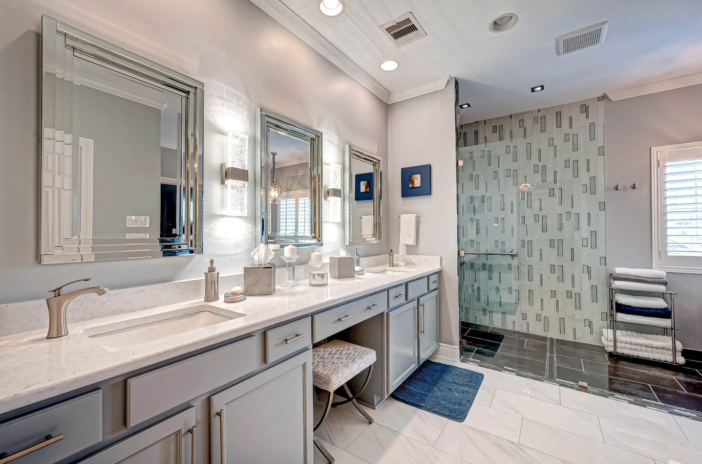 double vanity beside open glass shower with new wall tile
