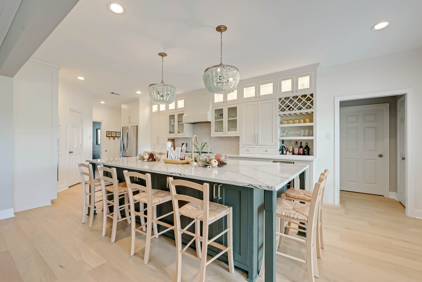 kitchen remodel with custom island and cabinets in Missouri City, Texas by Monumental Homes