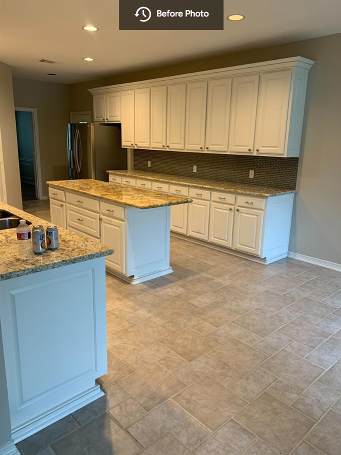 before photo of original kitchen with dated cabinets and tile floor